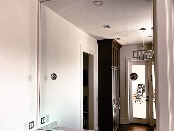 Large custom wall mirror installation