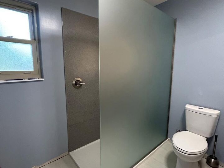 Floor-to-ceiling privacy glass shower panel